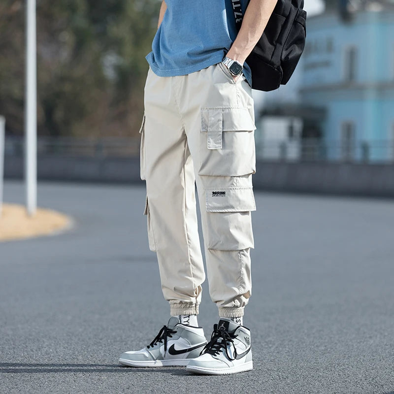 Pantalon cargo surdimensionné pour homme, streetwear, jogging noir, décontracté, taille élastique, sarouel, grande taille 5XL