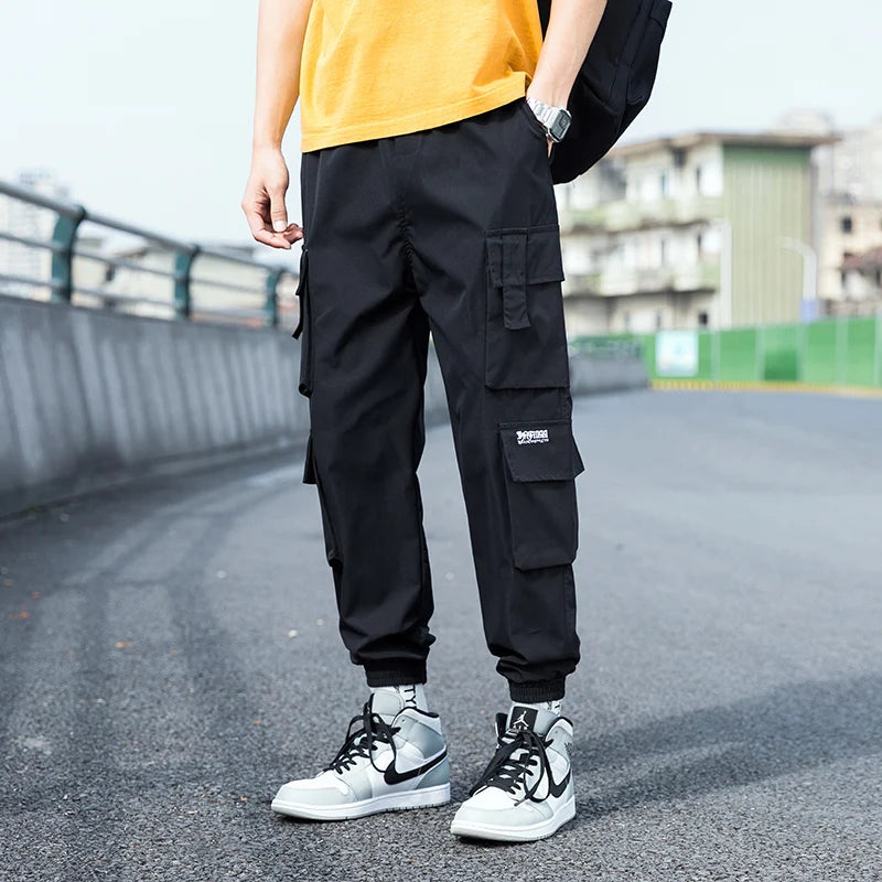 Pantalon cargo surdimensionné pour homme, streetwear, jogging noir, décontracté, taille élastique, sarouel, grande taille 5XL